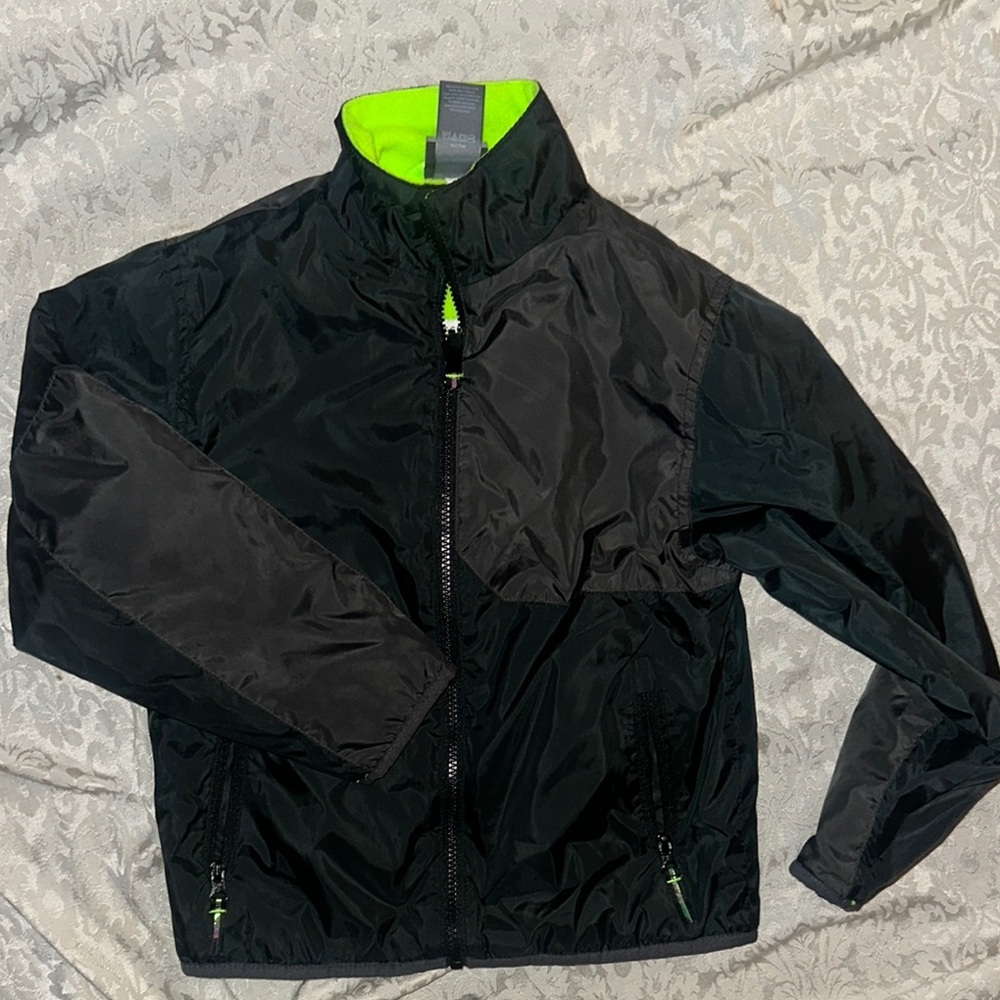Black Size 6/7 Champion Jacket with Neon Accents.